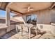 Covered patio offers an outdoor dining area with table and seating at 13051 N 75Th Dr, Peoria, AZ 85381