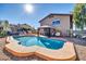 Backyard pool with a gazebo and slide, with a full view of the home's exterior in the background at 13051 N 75Th Dr, Peoria, AZ 85381