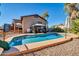 Backyard pool with a gazebo, slide, view of the house with stairs, and partial fence at 13051 N 75Th Dr, Peoria, AZ 85381