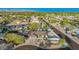 Wide aerial view showcasing the home, surrounding neighborhood, and mountain backdrop at 13601 N 50Th Pl, Scottsdale, AZ 85254