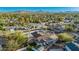 Aerial view showcasing the house with a pool, yard, and neighborhood landscape at 13601 N 50Th Pl, Scottsdale, AZ 85254