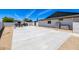 Backyard slab with partial view of the home's exterior and perimeter walls at 13601 N 50Th Pl, Scottsdale, AZ 85254