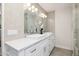 Stylish bathroom with tiled walls, dual vanity with contemporary faucets and modern lighting at 13601 N 50Th Pl, Scottsdale, AZ 85254