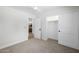 Bedroom featuring neutral carpet, ceiling fan, and closet with sliding doors at 13601 N 50Th Pl, Scottsdale, AZ 85254