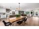 Open concept living/dining area, featuring sleek wood floors and modern decor at 13601 N 50Th Pl, Scottsdale, AZ 85254