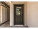 Close-up of home entryway showcasing a modern door with glass window at 13601 N 50Th Pl, Scottsdale, AZ 85254