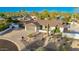 Charming single-story home with desert landscaping and a spacious driveway at 13601 N 50Th Pl, Scottsdale, AZ 85254