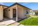 Home exterior featuring private entrance, artificial turf, and landscaped areas at 13601 N 50Th Pl, Scottsdale, AZ 85254
