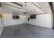Bright garage with epoxy floors and wall-mounted cabinets at 13601 N 50Th Pl, Scottsdale, AZ 85254