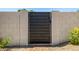 Modern black horizontal slat gate between block wall with pavers at 13601 N 50Th Pl, Scottsdale, AZ 85254