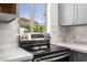 Close-up of the stainless steel stove and white marble countertops in the kitchen at 13601 N 50Th Pl, Scottsdale, AZ 85254