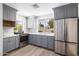Stylish kitchen featuring stainless steel appliances and shaker cabinets at 13601 N 50Th Pl, Scottsdale, AZ 85254