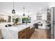 Open kitchen with island, modern fixtures, and easy access to dining area at 13601 N 50Th Pl, Scottsdale, AZ 85254