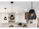 Close up of modern kitchen featuring updated decorative lighting and shelving at 13601 N 50Th Pl, Scottsdale, AZ 85254