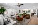 Open-concept living space with natural light, modern furniture, and seamless flow to the kitchen and dining area at 13601 N 50Th Pl, Scottsdale, AZ 85254