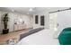 Sun-filled main bedroom with calming paint, streamlined furnishings, and a barn door to the ensuite at 13601 N 50Th Pl, Scottsdale, AZ 85254