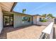 Private brick patio with view of the neighborhood through the picture window at 13601 N 50Th Pl, Scottsdale, AZ 85254