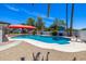Backyard pool with red awning and desert landscaping at 13601 N 50Th Pl, Scottsdale, AZ 85254