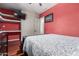 This bedroom has a full bed, built in shelving and storage and a large closet with white doors at 14538 W Sheridan St, Goodyear, AZ 85395