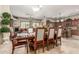 Open-concept dining area with ample seating and seamless flow into the living room and kitchen at 14538 W Sheridan St, Goodyear, AZ 85395