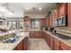 Spacious kitchen features granite counters, stainless appliances, and ample cabinet storage at 14538 W Sheridan St, Goodyear, AZ 85395
