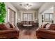 Elegant living room showcases hardwood floors, neutral tones, and comfortable seating arrangements at 14538 W Sheridan St, Goodyear, AZ 85395