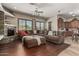 Inviting living room featuring a stone fireplace and an open concept floorplan at 14538 W Sheridan St, Goodyear, AZ 85395