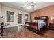 Spacious bedroom features hardwood floors, ensuite bathroom, and plentiful natural light at 14538 W Sheridan St, Goodyear, AZ 85395