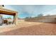 Large, low-maintenance backyard featuring a covered patio, ideal for relaxing and entertaining at 16807 W Carmen Dr, Surprise, AZ 85388