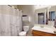 Clean bathroom with tub and shower combo, single sink vanity and a mirror at 16807 W Carmen Dr, Surprise, AZ 85388