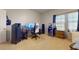 Finished bedroom features a gaming setup, hardwood floors, and natural light at 16807 W Carmen Dr, Surprise, AZ 85388