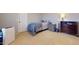 Cozy bedroom with carpet, soft lighting, dresser, and a twin bed at 16807 W Carmen Dr, Surprise, AZ 85388