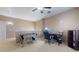 Versatile bonus room with a foosball table, desk, and chair, creating a great space for work or play at 16807 W Carmen Dr, Surprise, AZ 85388