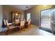 Formal dining room with a decorative china cabinet and an entrance door at 16807 W Carmen Dr, Surprise, AZ 85388