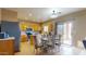 Eat-in kitchen showcases wood cabinets, stainless appliances, and a sliding glass door to the patio at 16807 W Carmen Dr, Surprise, AZ 85388