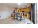 Open kitchen and dining area with stainless steel appliances and tile floors at 16807 W Carmen Dr, Surprise, AZ 85388