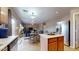 Open-concept kitchen with stainless steel appliances and adjacent dining area filled with natural light at 16807 W Carmen Dr, Surprise, AZ 85388