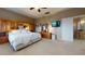 Spacious main bedroom with an attached wardrobe and a wall-mounted TV for entertainment at 16807 W Carmen Dr, Surprise, AZ 85388