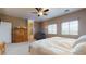 Spacious main bedroom with attached bathroom and natural light from two windows at 16807 W Carmen Dr, Surprise, AZ 85388