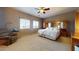 Spacious main bedroom with an attached wardrobe and two windows providing natural light at 16807 W Carmen Dr, Surprise, AZ 85388