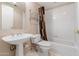 Bathroom with neutral color scheme, a pedestal sink and shower-tub combination at 1747 E Northern Ave # 104, Phoenix, AZ 85020