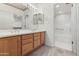 Bathroom featuring double sinks, bright lighting, and a shower-tub combination at 1747 E Northern Ave # 104, Phoenix, AZ 85020