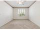 Bright bedroom with neutral carpet and plantation shutters at 1747 E Northern Ave # 104, Phoenix, AZ 85020