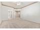 Spacious bedroom featuring carpet and adjacent bathroom and hallway entrances at 1747 E Northern Ave # 104, Phoenix, AZ 85020