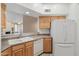 A charming kitchen with wood cabinets, white appliances and plenty of counter space at 1747 E Northern Ave # 104, Phoenix, AZ 85020