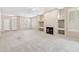 Large living room with fireplace and big windows giving lots of light and neutral carpet at 1747 E Northern Ave # 104, Phoenix, AZ 85020