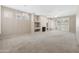 Inviting living room featuring a fireplace, decorative lighting and plantation shutters at 1747 E Northern Ave # 104, Phoenix, AZ 85020