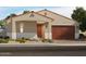 Beautiful single-story home featuring a covered entry, desert landscaping, and a two-car garage at 17567 W Pierson St, Goodyear, AZ 85395
