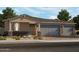 Charming single-story home featuring a three-car garage, stone accents, and low-maintenance landscaping at 17667 W Mariposa Dr, Goodyear, AZ 85395