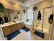 Bright bathroom with a soaking tub, glass enclosed shower, double sinks and nice natural light at 2014 N 93Rd Dr, Phoenix, AZ 85037